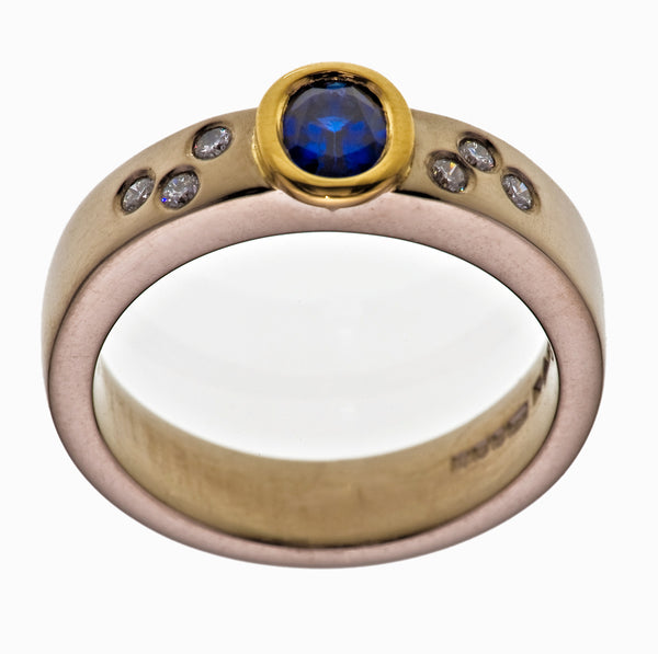 Oval Cut 1.2ct Sapphire Set 18ct. Yellow Gold 4.5mm Platinum Band Brilliant Cut Diamonds 0.20ct - David Smith Jewellery