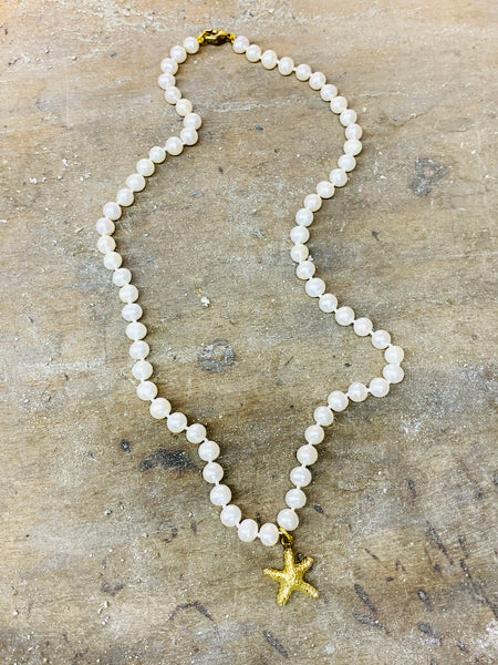 Seashore collection starfish pendant on white freshwater pearl necklace yellow gold vermeil on sterling silver and white freshwater pearls with yellow gold on sterling silver catch. Starfish 18mm pearls 5.5mm and length 425mm (16 3/4 inch) length including catch-David Smith Jewellery 