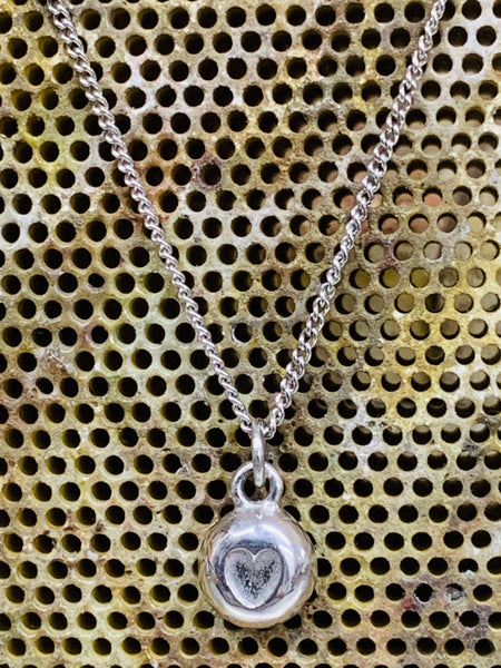 Heart nugget pendant sterling silver close curb chain 7mm diameter.