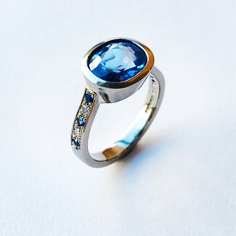 Handmade 18ct 750 White Gold Ring 3.3ct Cushion Oval Cut Sri Lankan Blue Sapphire with Six Brilliant Cut Sapphires and Four Brilliant Cut Diamonds Pave Set on Raised Shoulders Contemporary - David Smith Jewellery